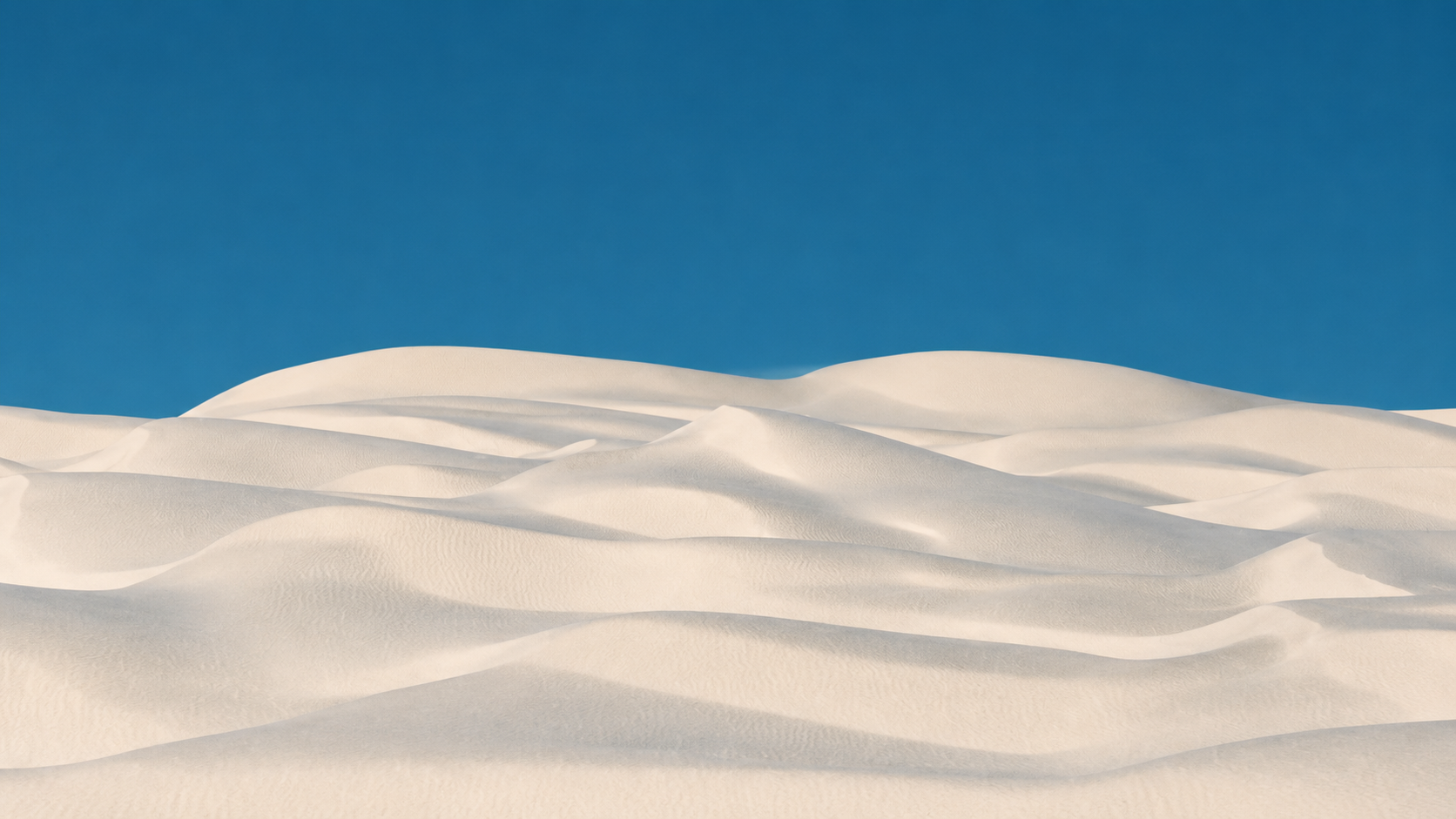White dunes beneath a blue sky
